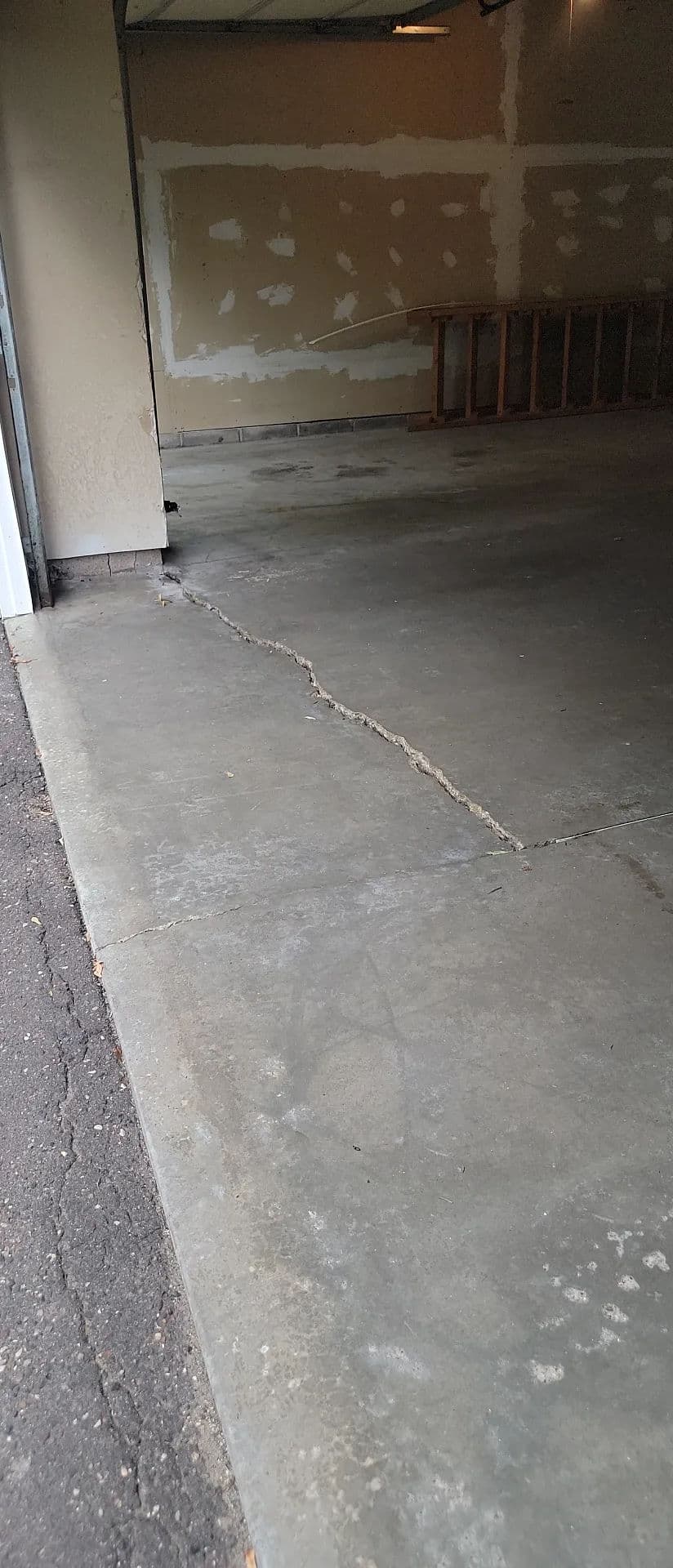 Settled Garage Floor Concrete Lifting in Oakdale MN Before a Home Sale image